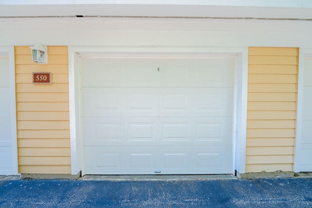 garage featuring wood walls