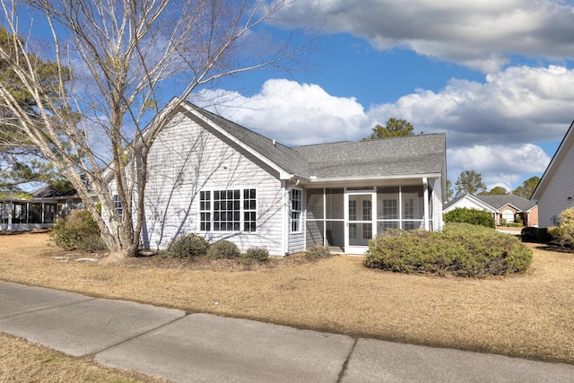 view of front of house featuring a sunroom