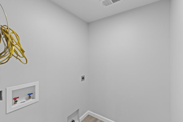7239 Commodore Rd, Hollywood, SC 29449 - laundry room featuring hookup for a washing machine, electric dryer hookup, light wood finished floors, and baseboards