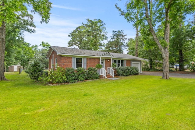 7239 Commodore Rd, Hollywood, SC 29449 - single story home featuring an attached garage, a front yard, driveway, and brick siding