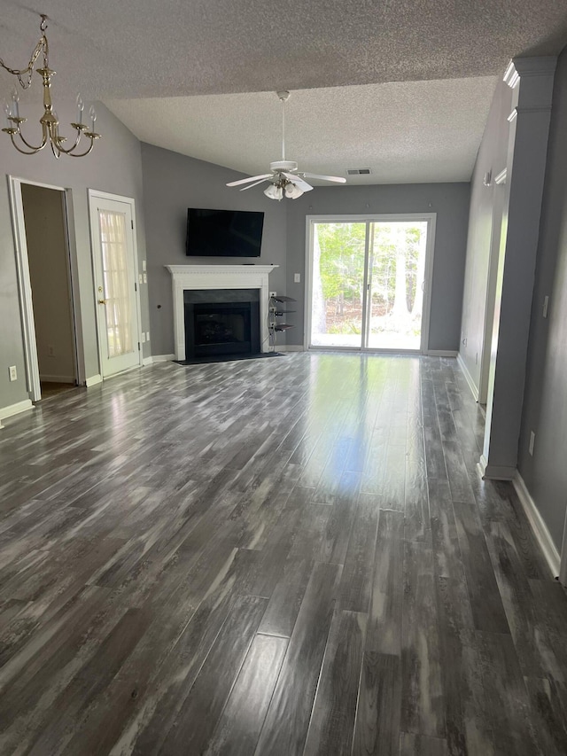214 Hardee Ave, Summerville, SC 29485 - unfurnished living room featuring ceiling fan with notable chandelier, a textured ceiling, dark wood-style floors, visible vents, and a fireplace