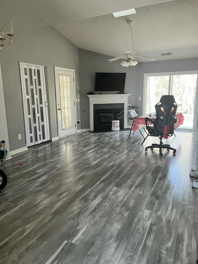 214 Hardee Ave, Summerville, SC 29485 - living room with lofted ceiling, a fireplace with flush hearth, ceiling fan, visible vents, and wood finished floors