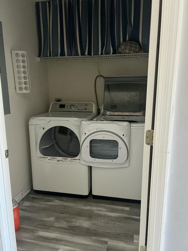214 Hardee Ave, Summerville, SC 29485 - washroom featuring washing machine and clothes dryer, baseboards, wood finished floors, and laundry area