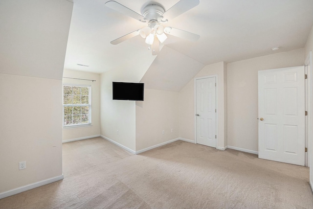 bonus room featuring carpet floors, baseboards, a ceiling fan, and lofted ceiling