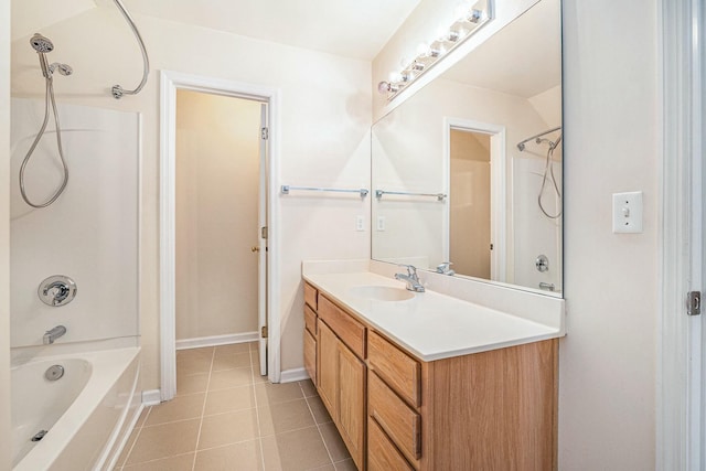 bathroom with tile patterned flooring, vanity, baseboards, and shower / bathing tub combination