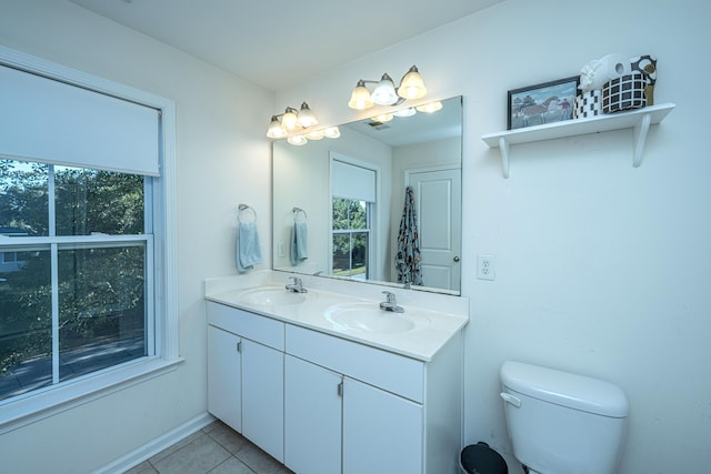 bathroom with tile patterned floors, toilet, and vanity