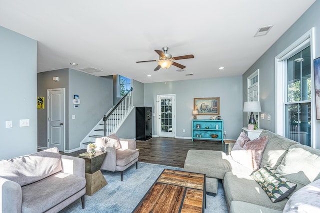 living room with ceiling fan and wood-type flooring