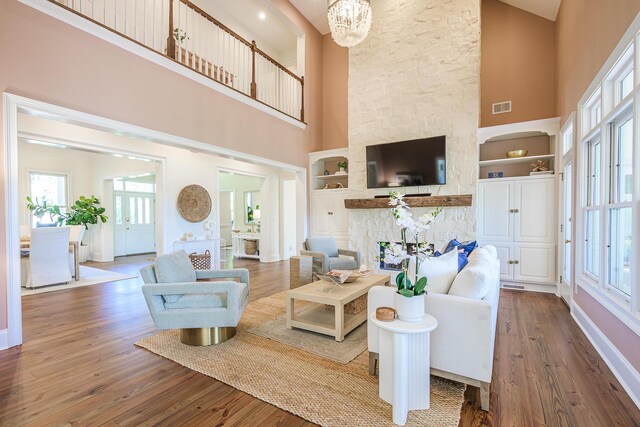 3130 Pignatelli Cres, Mount Pleasant, SC 29466 - living room with a towering ceiling, built in features, wood finished floors, and baseboards