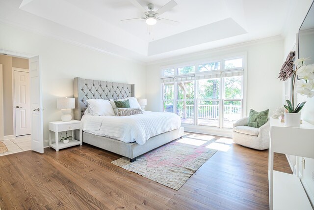 3130 Pignatelli Cres, Mount Pleasant, SC 29466 - bedroom with a tray ceiling, wood finished floors, access to exterior, ornamental molding, and a ceiling fan