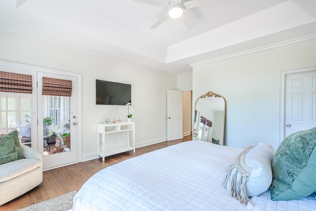 3130 Pignatelli Cres, Mount Pleasant, SC 29466 - bedroom featuring wood finished floors, a tray ceiling, crown molding, access to outside, and baseboards