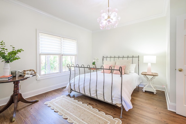 3130 Pignatelli Cres, Mount Pleasant, SC 29466 - bedroom featuring crown molding, baseboards, a chandelier, and wood finished floors