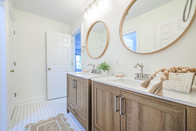 3130 Pignatelli Cres, Mount Pleasant, SC 29466 - bathroom featuring tile patterned floors, two vanities, and baseboards