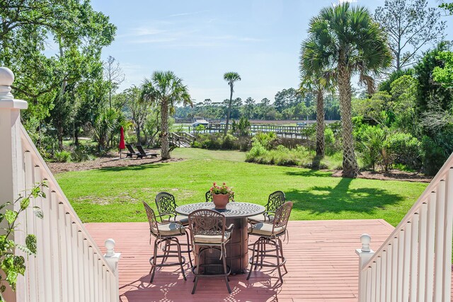 3130 Pignatelli Cres, Mount Pleasant, SC 29466 - wooden terrace featuring a yard, outdoor dining space, and view of scattered trees