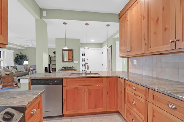 kitchen featuring backsplash, ceiling fan, stone counters, a peninsula, and stainless steel dishwasher