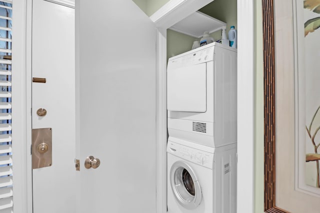 washroom with laundry area and stacked washer and clothes dryer