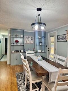 1045 Autumn Ln, Summerton, SC 29148 - dining space featuring a textured ceiling, built in features, and light wood-style floors