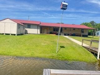 1045 Autumn Ln, Summerton, SC 29148 - rear view of house featuring an outdoor structure, a shed, and a lawn