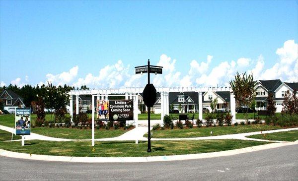 view of community with a residential view and a yard