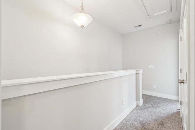 corridor with light colored carpet