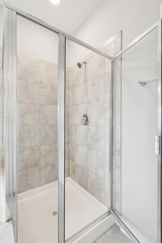 bathroom featuring an enclosed shower