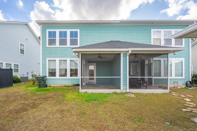 rear view of property with a sunroom, cooling unit, ceiling fan, a yard, and a patio area