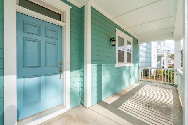 property entrance featuring covered porch