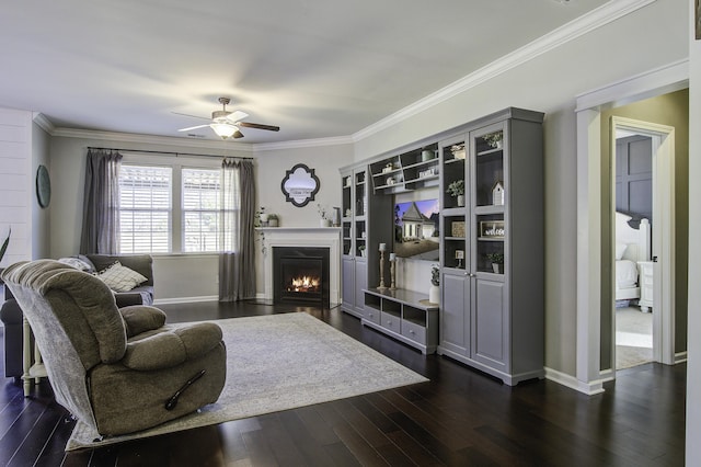 living room featuring crown molding, ceiling fan, and dark hardwood / wood-style flooring