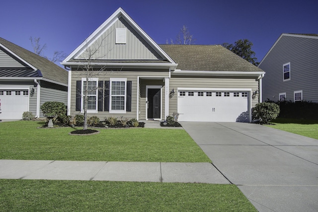 craftsman-style house featuring a garage and a front lawn