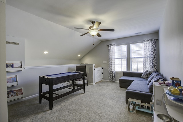 carpeted office space with lofted ceiling and ceiling fan