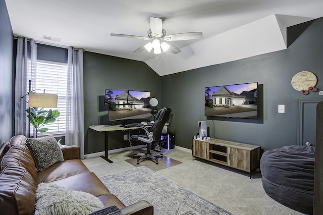 carpeted office with vaulted ceiling and ceiling fan