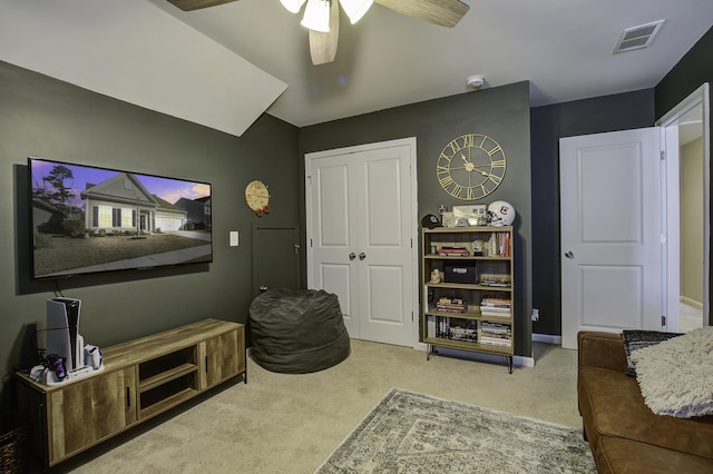 cinema room with carpet flooring and ceiling fan