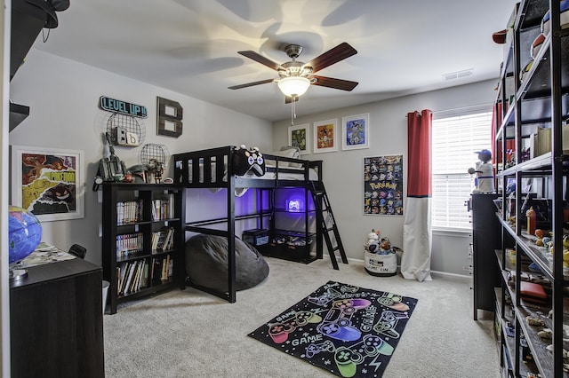 bedroom featuring ceiling fan and light carpet