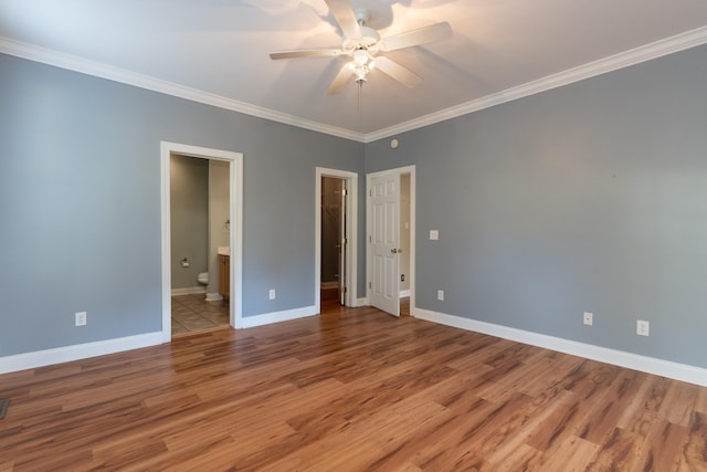 unfurnished bedroom featuring ornamental molding, hardwood / wood-style flooring, connected bathroom, and ceiling fan