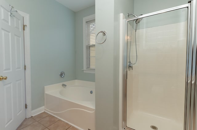 bathroom with tile patterned floors and separate shower and tub