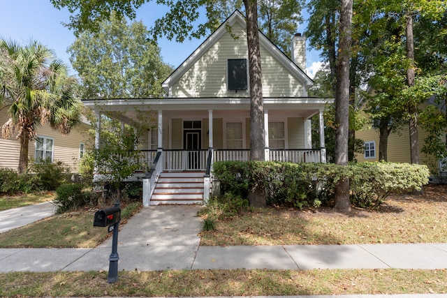 farmhouse inspired home with a porch