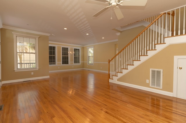 unfurnished living room featuring light hardwood / wood-style floors, ornamental molding, and ceiling fan