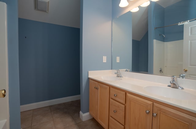 bathroom with vanity, shower / washtub combination, and tile patterned flooring