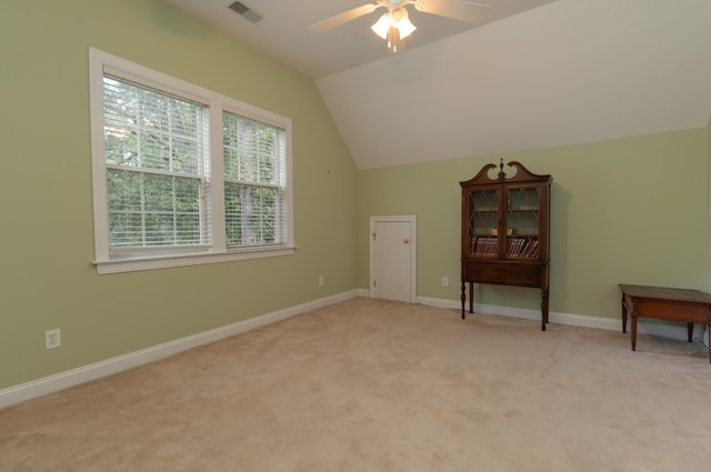 bonus room featuring light carpet, ceiling fan, and vaulted ceiling