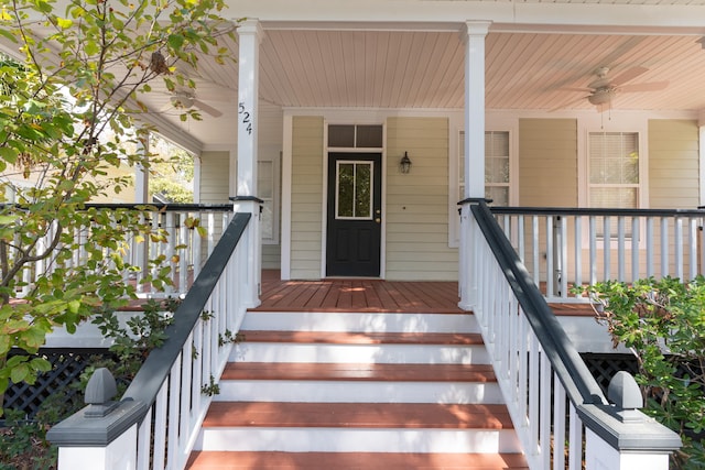 doorway to property featuring a porch and ceiling fan