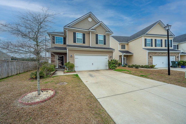 view of front of property with a garage and a front yard