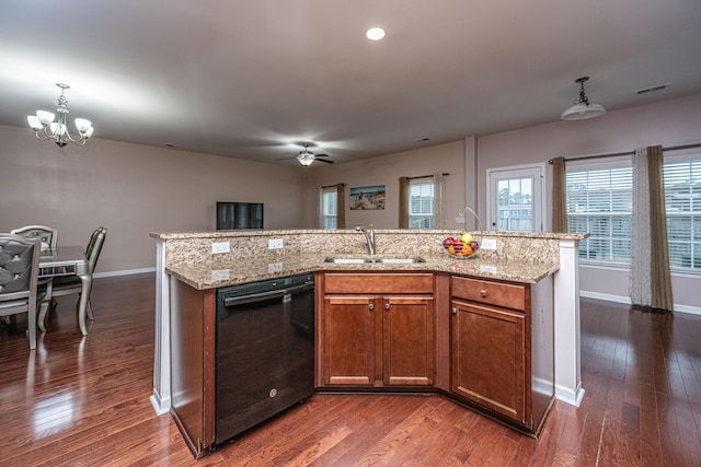 kitchen with sink, an island with sink, and dishwasher