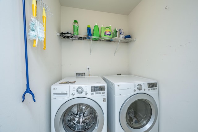 laundry room with independent washer and dryer