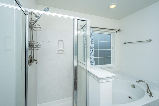 bathroom featuring plus walk in shower