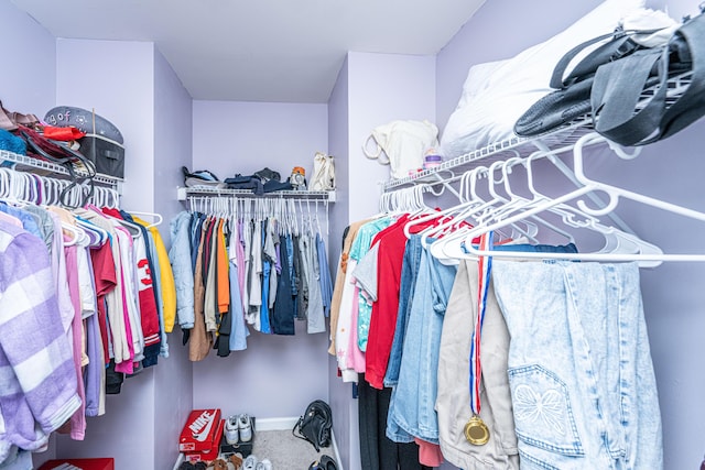 spacious closet featuring carpet floors