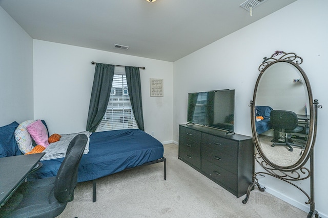 bedroom with light colored carpet