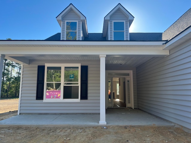 property entrance with covered porch