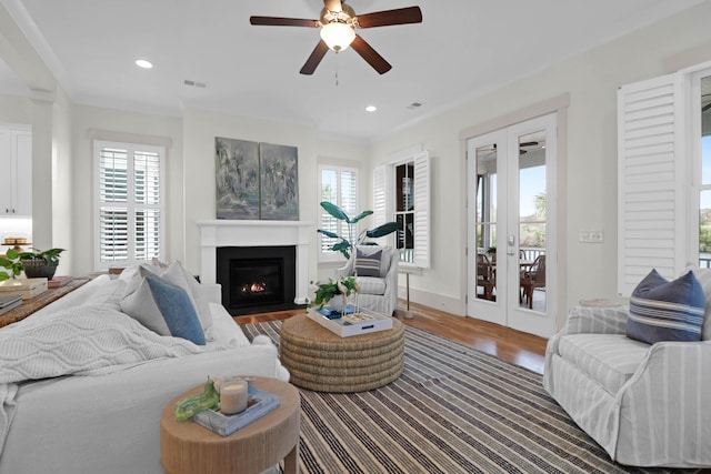 living room with ceiling fan, french doors, and plenty of natural light