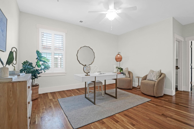 home office with ceiling fan and hardwood / wood-style flooring