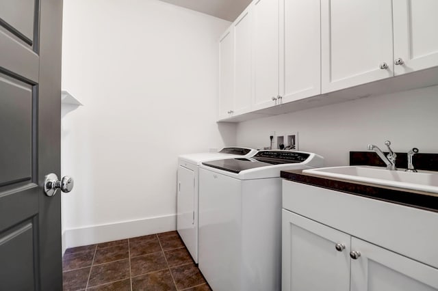 washroom with cabinets and independent washer and dryer