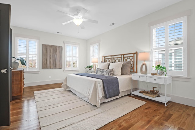 bedroom with hardwood / wood-style flooring and ceiling fan